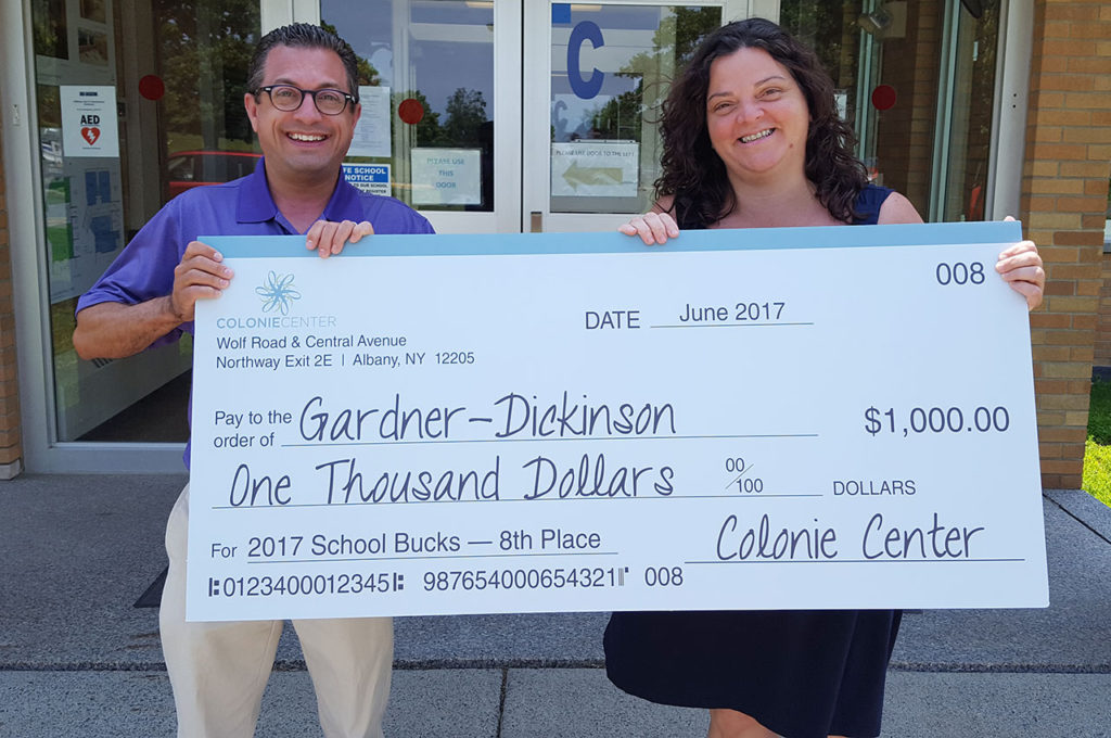 Superintendent Thomas Reardon and Principal Mary Yodis with check for school