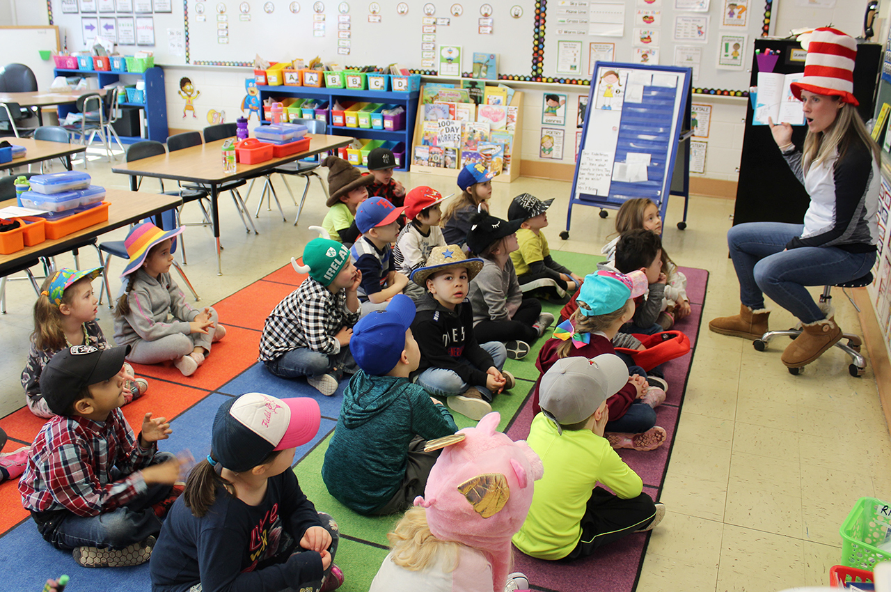 Students listen to Dr. Seuss book
